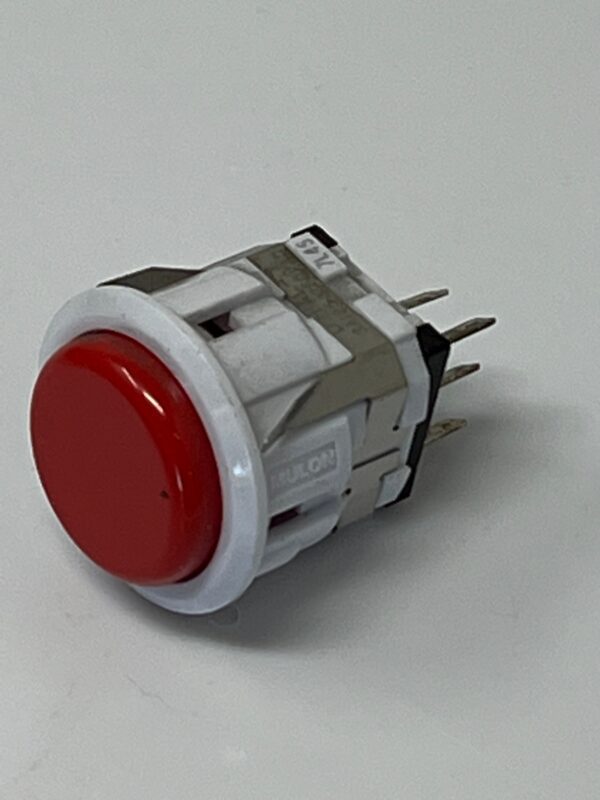 A white and red push button on a white surface for the 509-5329.
