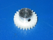 A white 24 tooth gear on a blue background.