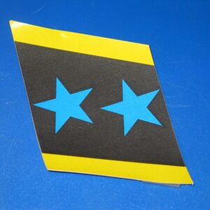 A blue and yellow After Burner Star Sticker - Right Hand Side on a blue surface.