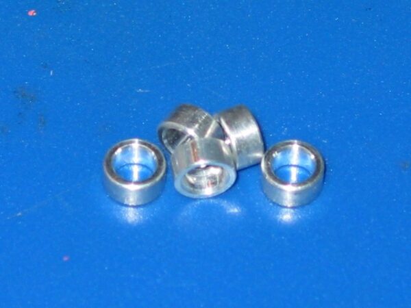 A set of 5 Steel Spacers on a blue surface.