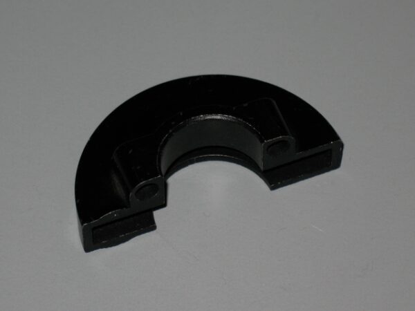 An Upper Case Clamp on a white surface.