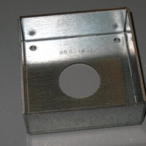 A metal box with a hole in the base.