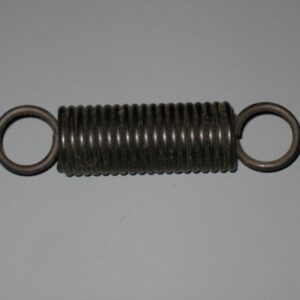 Close-up of a metal tension spring with circular end hooks.