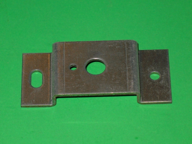A VR Bracket with holes on a green surface.