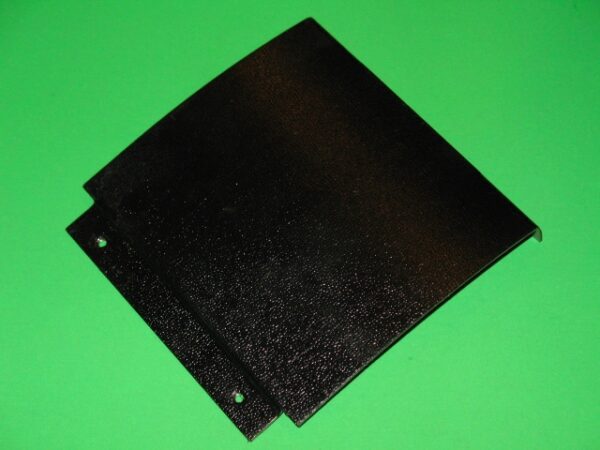 A black plastic Cover Plate on a green background.