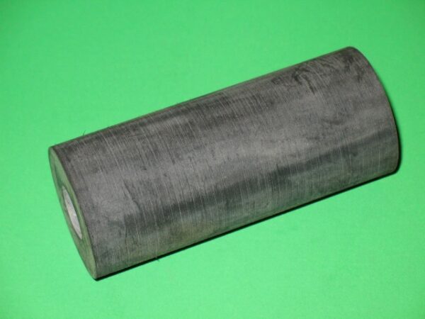 A roll of Cushion A on a green surface.