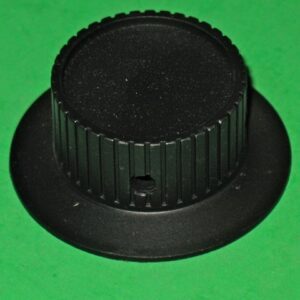 A 73-834 NOS Tempest or Warlords spinner KNOB on a green surface.