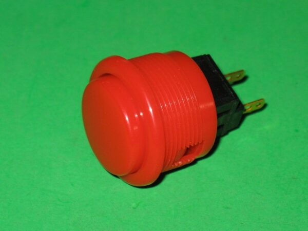 A 509-5323-01 Pushbutton, Red on a green background.