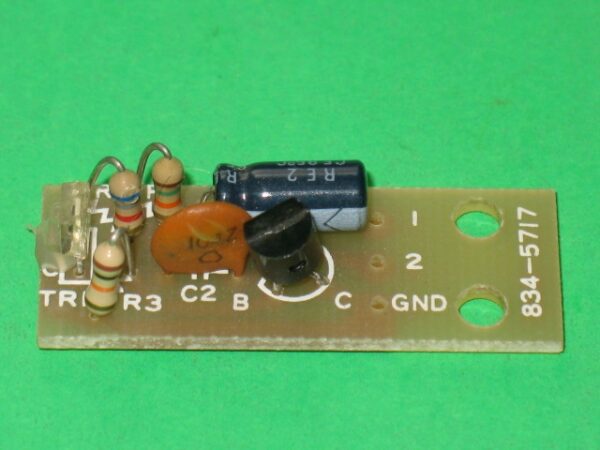 A small 834-5717 Photo Transistor board with a few electronic components on it.