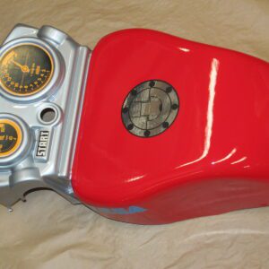 A red and silver Handle cover, 2 player, Red motorcycle with gauges on it.