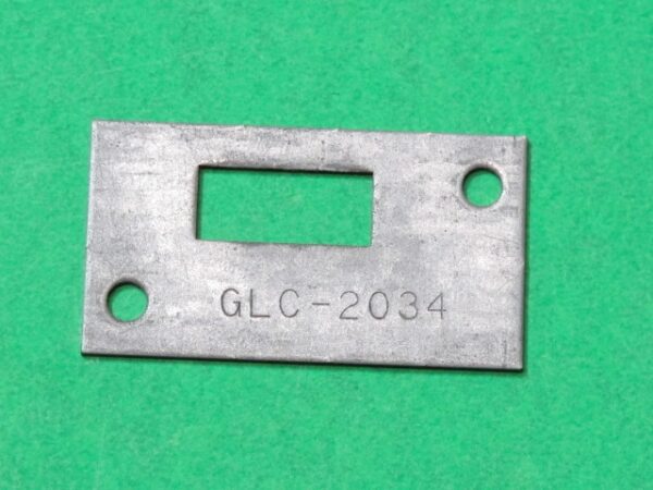 A metal plate with the word Bracket on it.