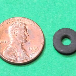 A penny next to a black Special washer.