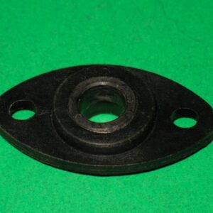 A black plastic 100-5015 nut on a green surface.