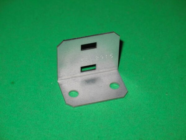 A metal Sensor on a green surface.