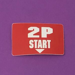 A sticker with the words 2 Player Start sticker, BBSN on it.