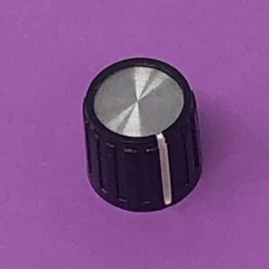 A Volume Knob on a purple surface.
