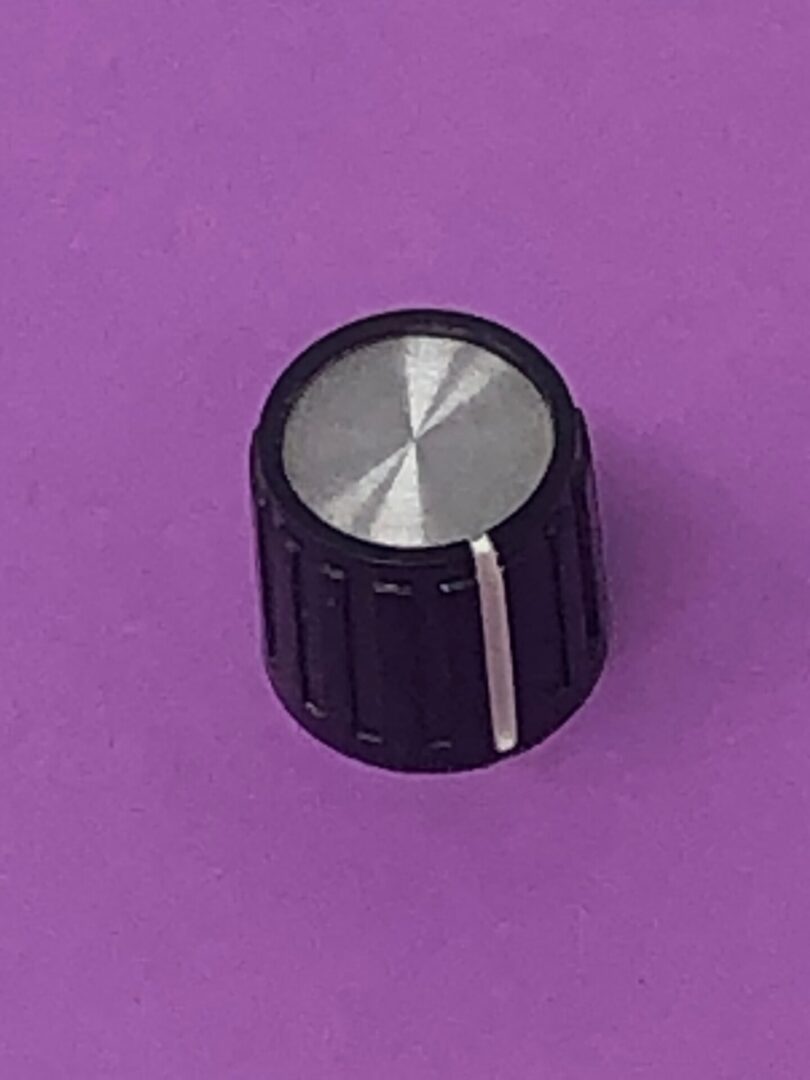 A Volume Knob on a purple surface.