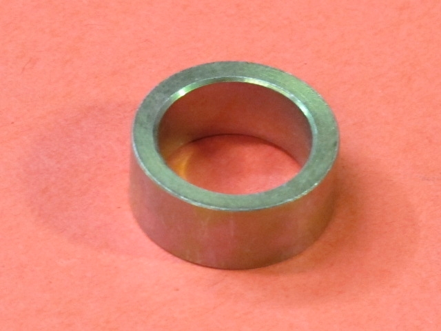 A Collar Actuate Shaft on a red surface.