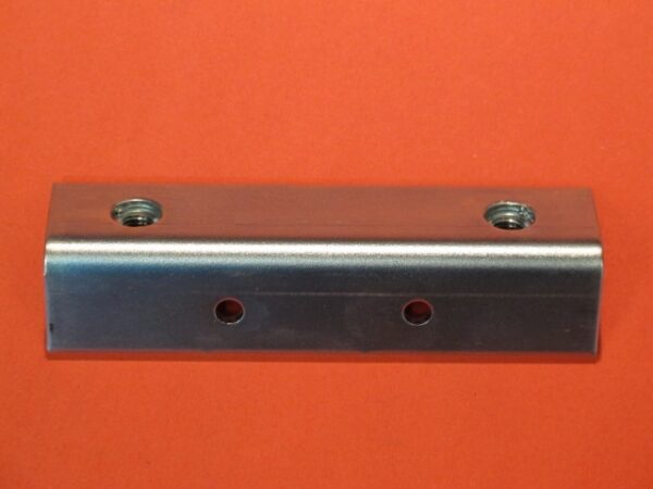 A stainless steel Cash Box Door on an orange background.