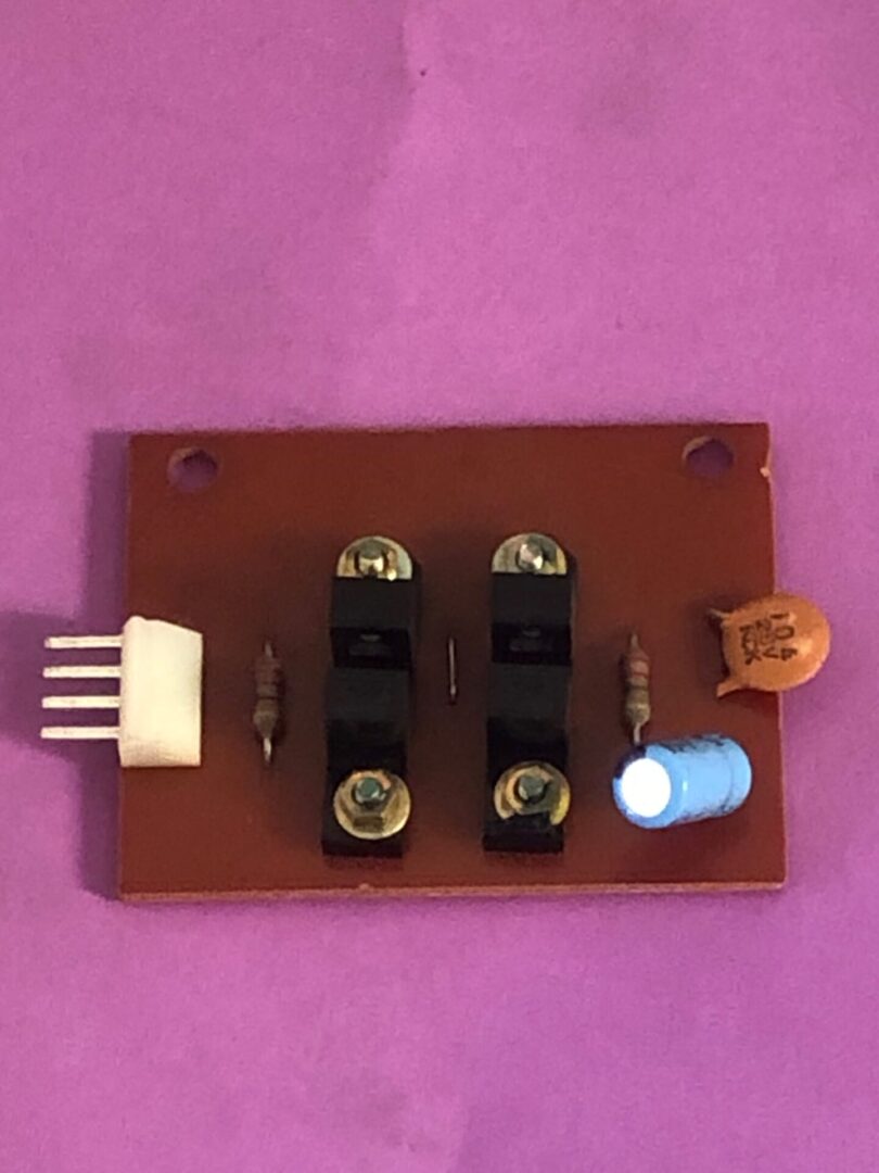 A small Accelerator Opto PCB with a light on it.