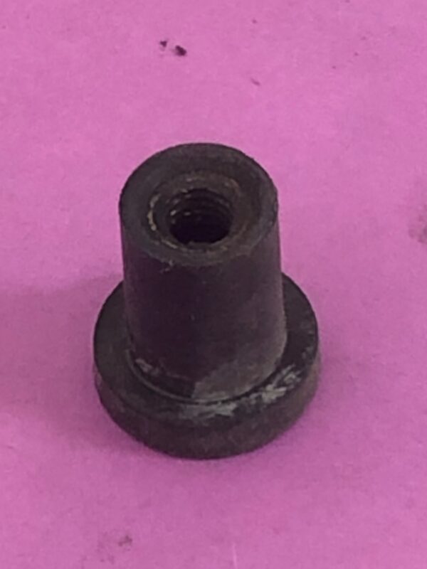 A black metal Well Nut with a nut.