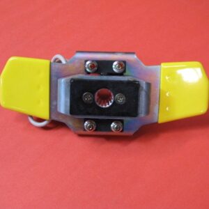 A yellow and black Butterfly Shifter Assembly holder on a red surface.