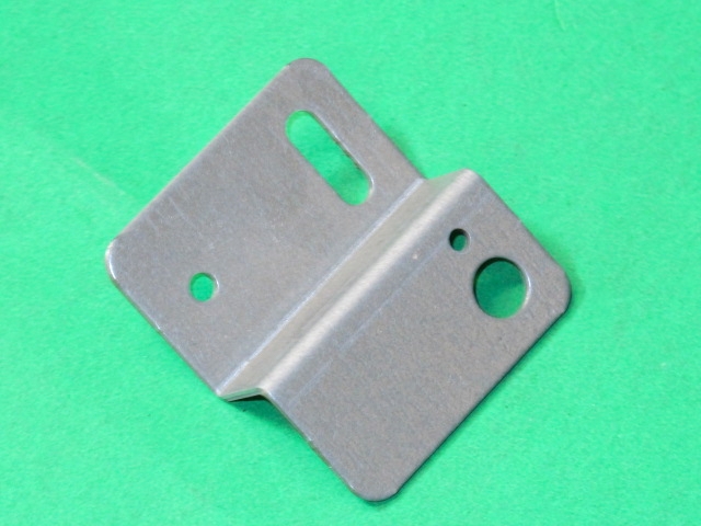 A Steering VR bracket on a green surface.