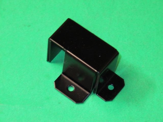 A black metal Bracket, Sensor A on a green surface.