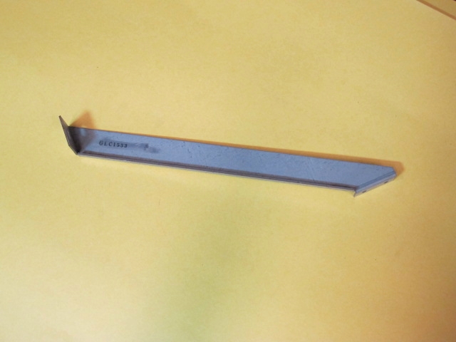 A small Bracket, Left Support on a yellow surface.