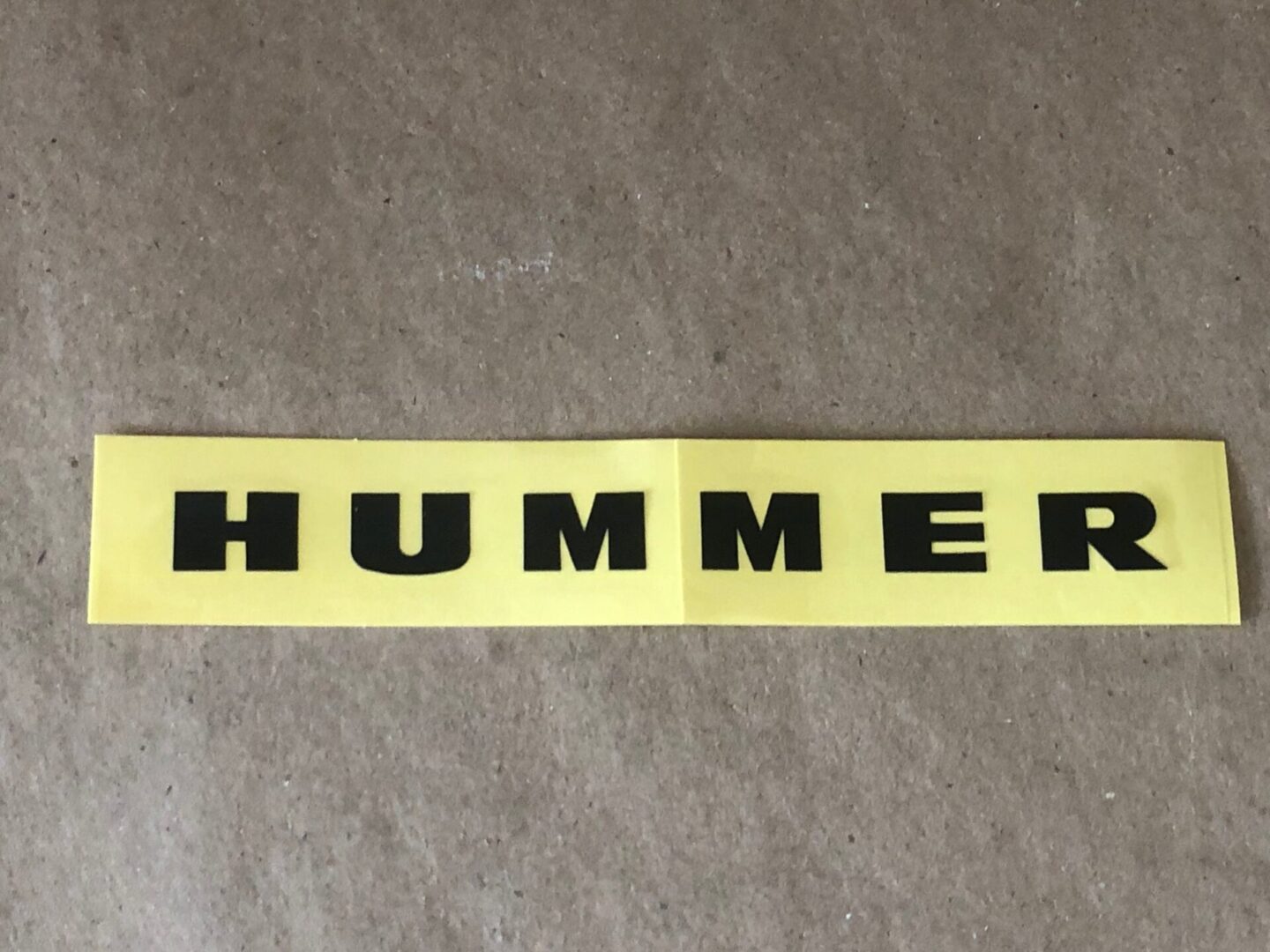 A yellow Decal, Hummer Logo sticker