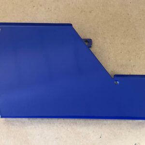 A blue plastic Control Cover Lid LEFT on a table.