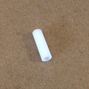 A white VIB Spacer sitting on a table.