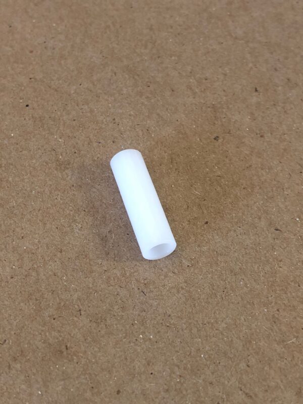 A white VIB Spacer sitting on a table.