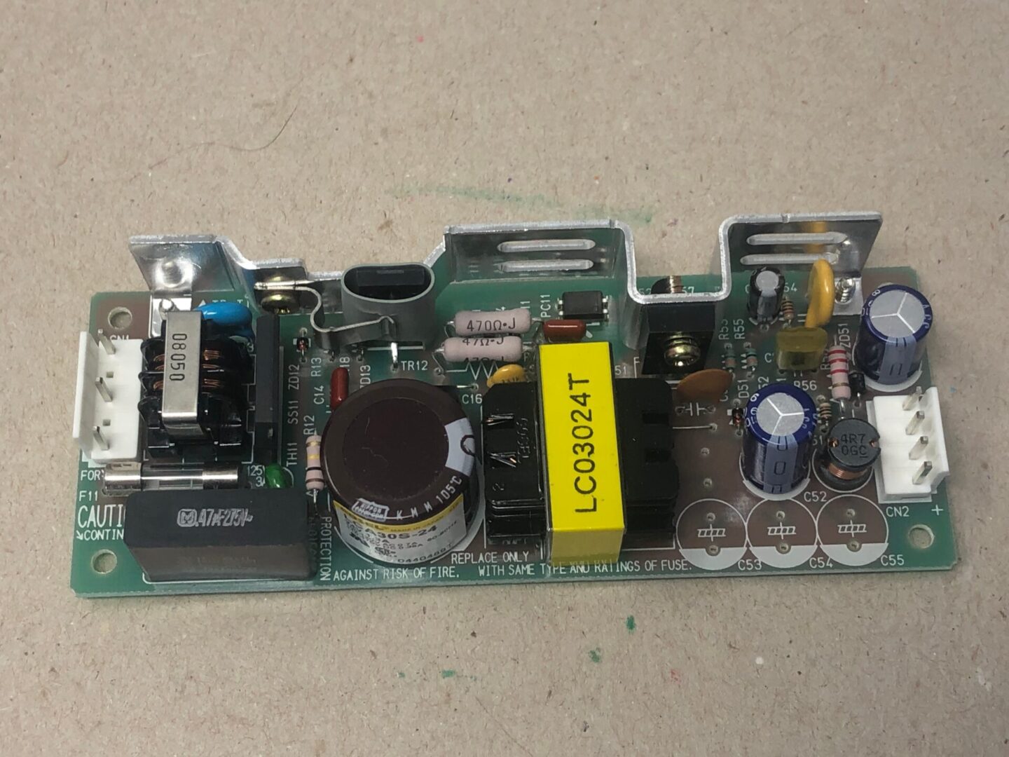 An LCAS-30524 power supply with electronic components on it.