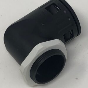 A black and white Connector 29 "L" Shaped fitting on a white surface.