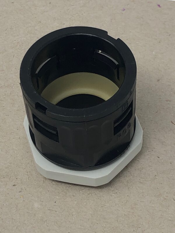 A black and white plastic Connector 29 on top of a table.