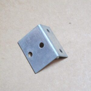 A Valve Bracket is a piece of metal with holes on it.
