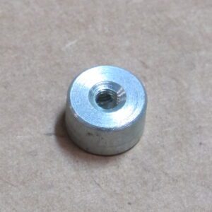 A small metal weight on a table.