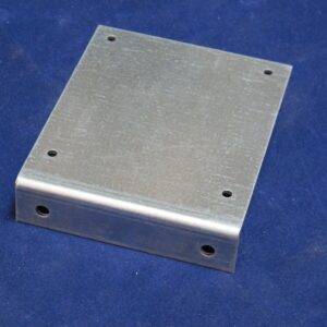 A Bracket or Coin Chute Base with holes on it.