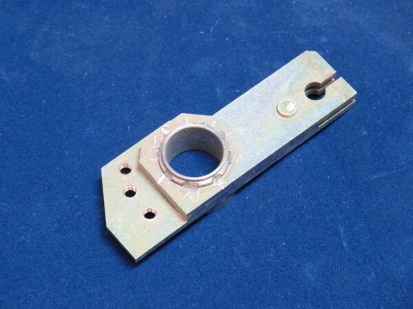 A VR Lever bracket with holes on a blue surface.