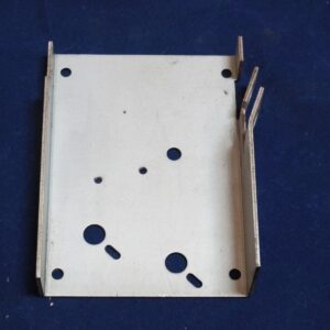A metal bracket with holes on it.