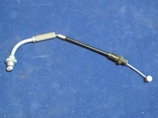 A Brake Cable, Hang On Upright with a metal handle on a blue surface.