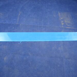 A Cover, Black Light plastic bar on a blue surface.