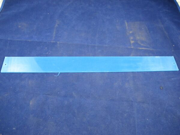 A Cover, Black Light plastic bar on a blue surface.