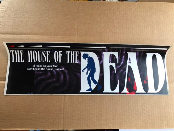 A cardboard box with a Deluxe Cabinet that says the house of the dead.