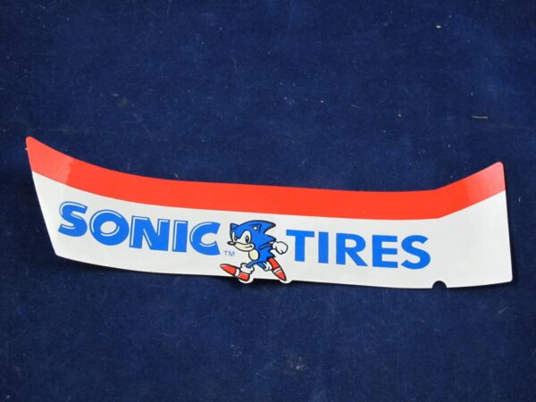 A Virtua Racing Marquee Decal SONIC TIRES on a blue surface.