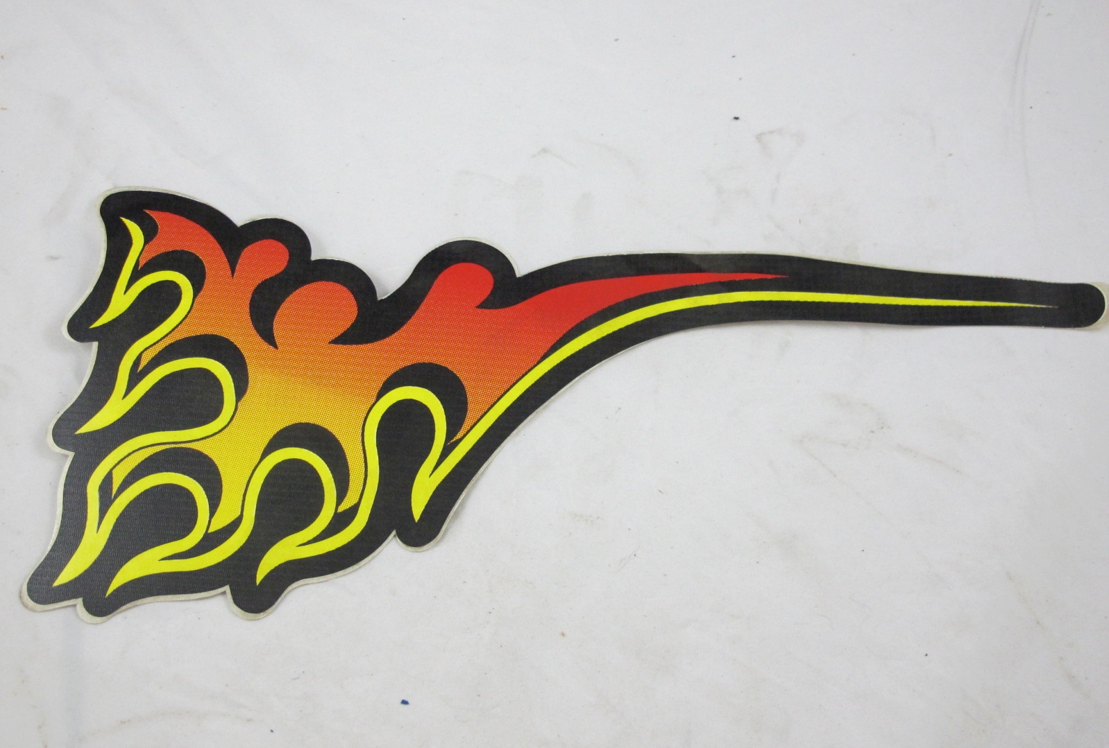 An image of a Sticker, Seat Side FLame, LEFT on a white surface.