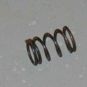 A 125-0011 Trigger spring on a white surface.