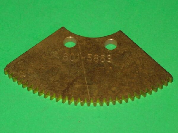 A 601-5863 blade on a green surface.