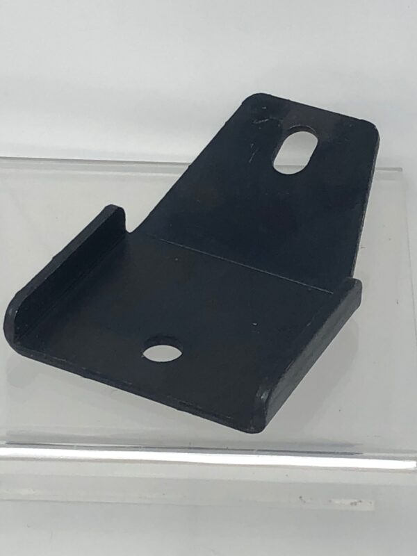 A black plastic Bracket on a clear surface.